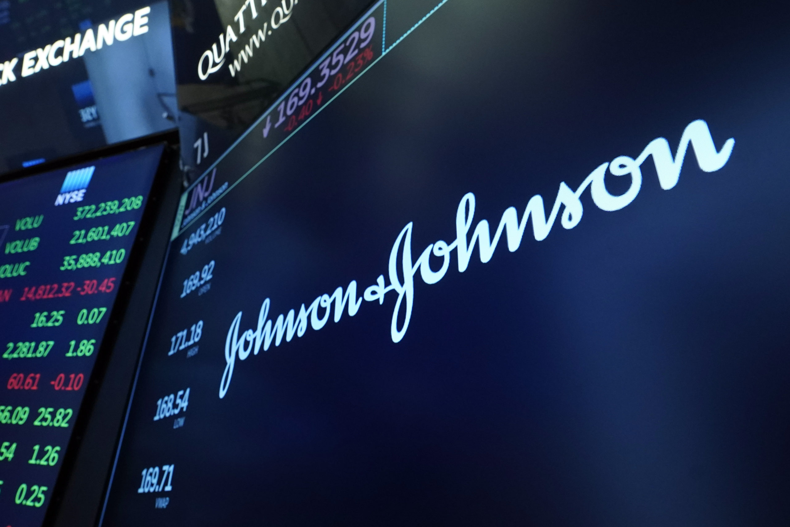 The Johnson & Johnson logo appears above a trading post on the floor of the New York Stock Exchange in New York City on July 21, 2021.