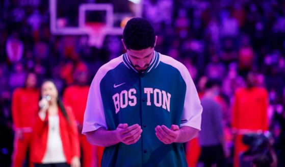 Enes Kanter #13 of the Boston Celtics during the national anthem prior to the first half against the Toronto Raptors at Scotiabank Arena on November 28, 2021 in Toronto, Canada.
