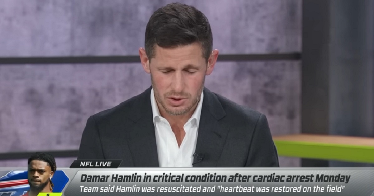 ESPN analyst and former NFL quarterback Dan Orlovsky bows his head in prayer on "NFL Live" on Tuesday.