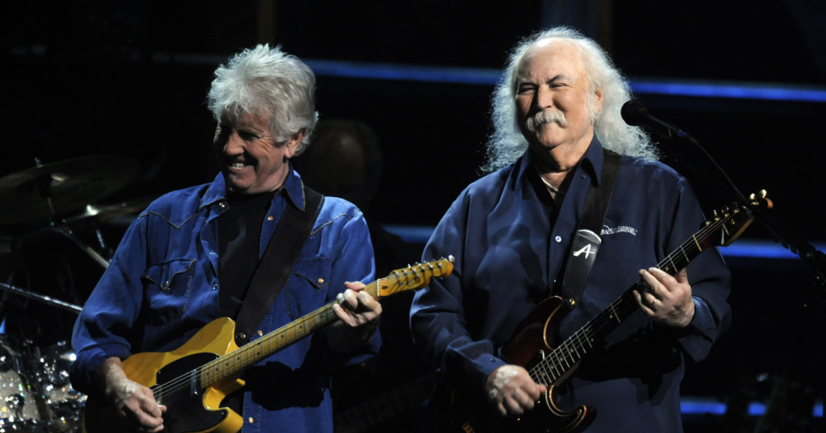 David Crosby and Graham Nash performing on stage