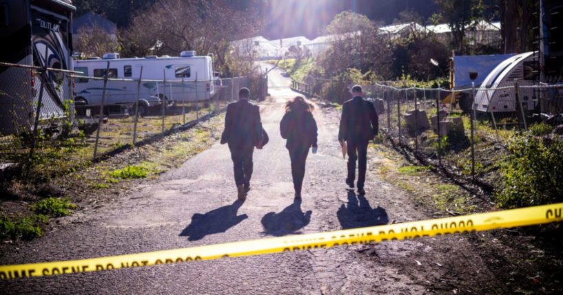 FBI officials walk towards the crime scene at Mountain Mushroom Farm on Tuesday after a gunman killed several people at two agricultural businesses in Half Moon Bay, California.