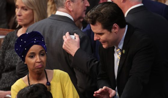 Republican Rep. Matt Gaetz talks to Democratic Rep. Ilhan Omar in the House Chamber during the third day of elections for Speaker of the House at the U.S. Capitol Building on Jan. 5 in Washington, D.C.