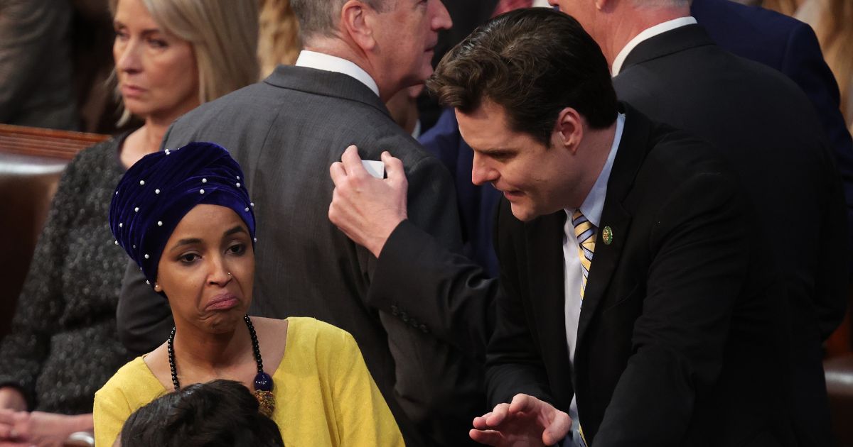 Republican Rep. Matt Gaetz talks to Democratic Rep. Ilhan Omar in the House Chamber during the third day of elections for Speaker of the House at the U.S. Capitol Building on Jan. 5 in Washington, D.C.