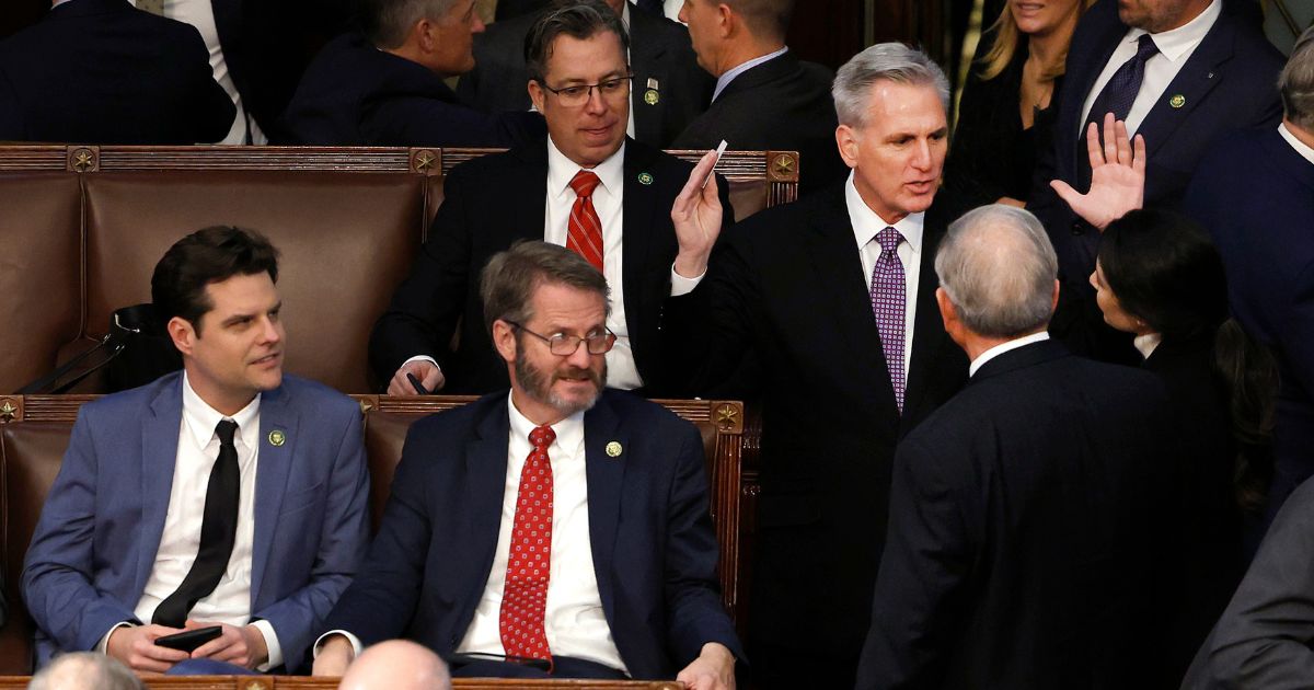House Republican Leader Kevin McCarthy, right, talks to members-elect as Rep.-elect Matt Gaetz, left and Rep.-elect Tim Burchett watch in the House Chamber during the second day of elections for Speaker of the House at the U.S. Capitol Building on Wednesday in Washington, D.C.