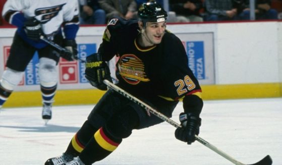 Leftwinger Gino Odjick of the Vancouver Canucks moves down the ice during a game against the Washington Capitals at the USAir Arena in Landover, Maryland.