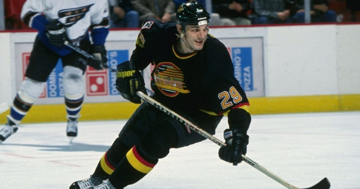 Leftwinger Gino Odjick of the Vancouver Canucks moves down the ice during a game against the Washington Capitals at the USAir Arena in Landover, Maryland.