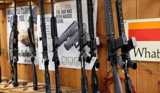 Rifles now banned for sale in the state are displayed at Freddie Bear Sports on Wednesday in Tinley Park, Illinois.