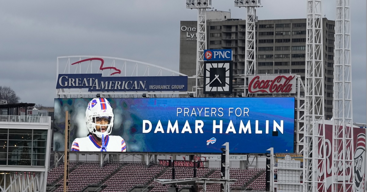 A scoreboard sign at Cincinnati's Great American Ballpark displays a photo of Buffalo Bills' Damar Hamlin and urges prayers for his recovery.