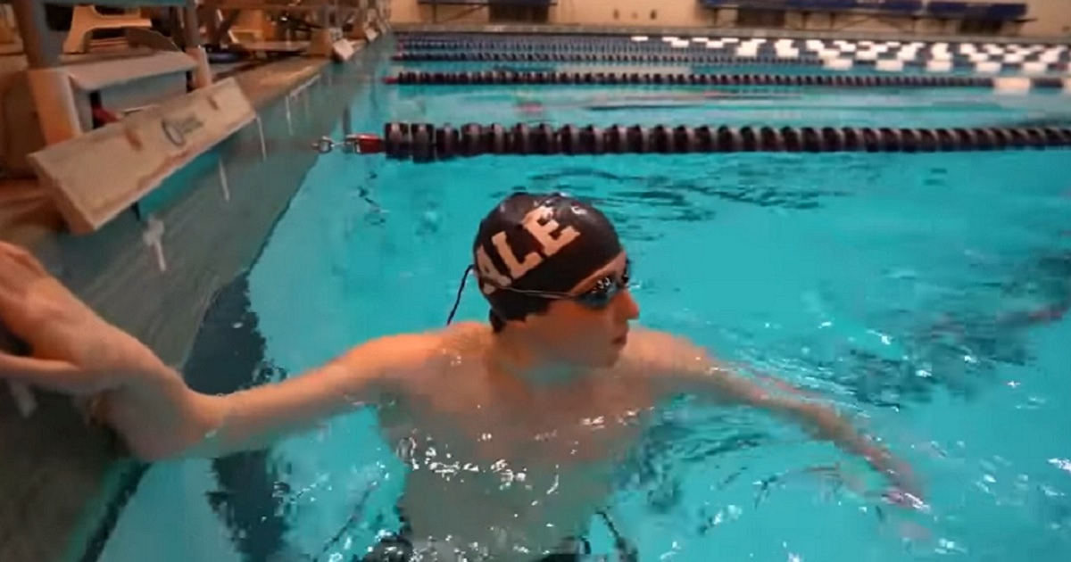 Yale swimmer Iszac Henig is pictured in a pool during an ABC profile from March 2022.