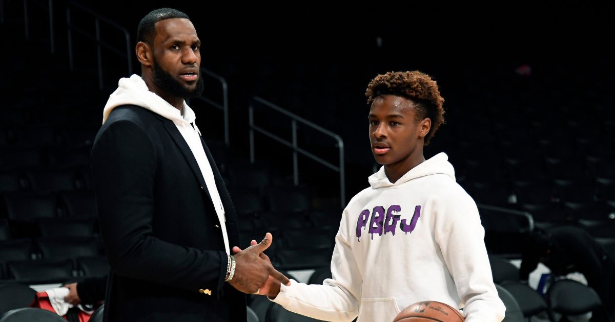 LeBron James #23 of the Los Angeles Lakers and his son LeBron James Jr., on the court after the Los Angeles Clippers and Los Angeles Lakers basketball game at Staples Center on Dec. 28, 2018, in Los Angeles.