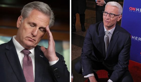 Kevin McCarthy (L) listens during a news conference following a caucus meeting at the U.S. Capitol Visitors Center February 13, 2019 in Washington, DC. Anderson Cooper (R) speaks with someone at the 16th annual CNN Heroes: An All-Star Tribute at American Museum of Natural History on December 11, 2022 in New York City.