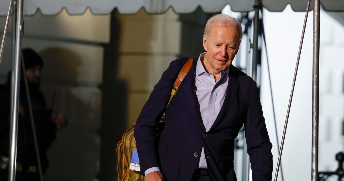 Joe Biden walks to speak to reporters as he and first lady Jill Biden leave the White House and walk to Marine One on the South Lawn on December 27, 2022 in Washington, DC.