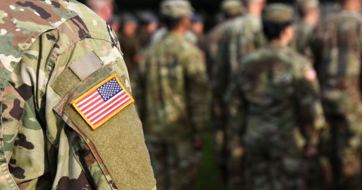 Soldiers stand at attention in this stock image.