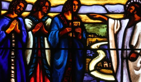 This stained glass window depicts Jesus and his disciples.