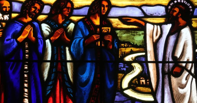 This stained glass window depicts Jesus and his disciples.