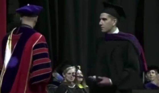 Bryan Kohberger, right, is seen at his college graduation.