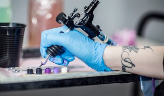 The above stock image is of a tattoo artist preparing.