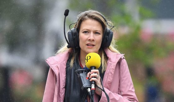 Jennie Gow of BBC Radio 5 Live with a microphone and headset