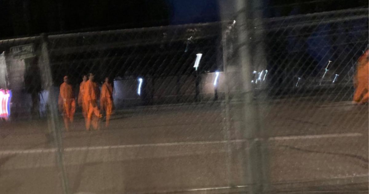 This screen shot reportedly shows orange-clad prison labor setting up Katie Hobbs' inauguration.