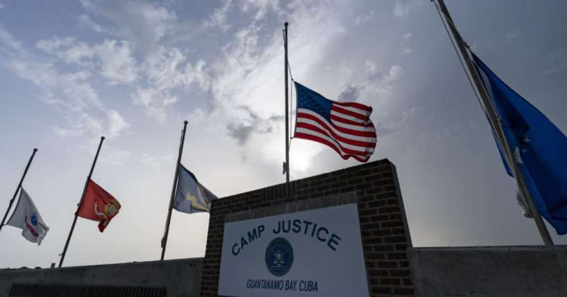 flags flying at half-staff at Camp Justice in Guantanamo Bay