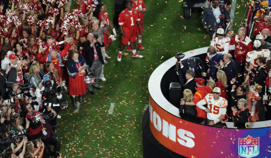 Kansas City Chiefs general manager Brett Veach holding the Vince Lombardi Trophy after Super Bowl 57