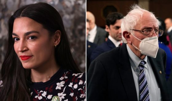 Rep. Alexandria Ocasio-Cortez, left, participates in an interview at the U.S. Capitol on Tuesday in Washington, D.C. Sen. Bernie Sanders arrives in the House chamber of the U.S. Capitol on Tuesday.