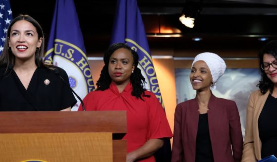 Democrat Reps. Alexandria Ocasio-Cortez of New York, Ayanna Pressley of Massachusetts, Ilhan Omar of Minnesota and Rashida Tlaib of Michigan are seen in a file photo from July 2019. All four voted against a resolution condemnig socialism Wednesday.