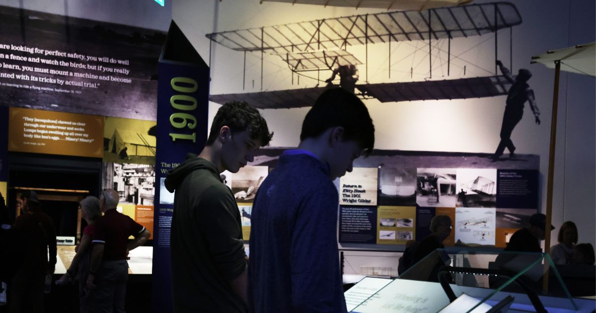 Unidentified visitors browse a Wright Brothers exhibit at The Smithsonian National Air and Space Museum in a file photo from October.