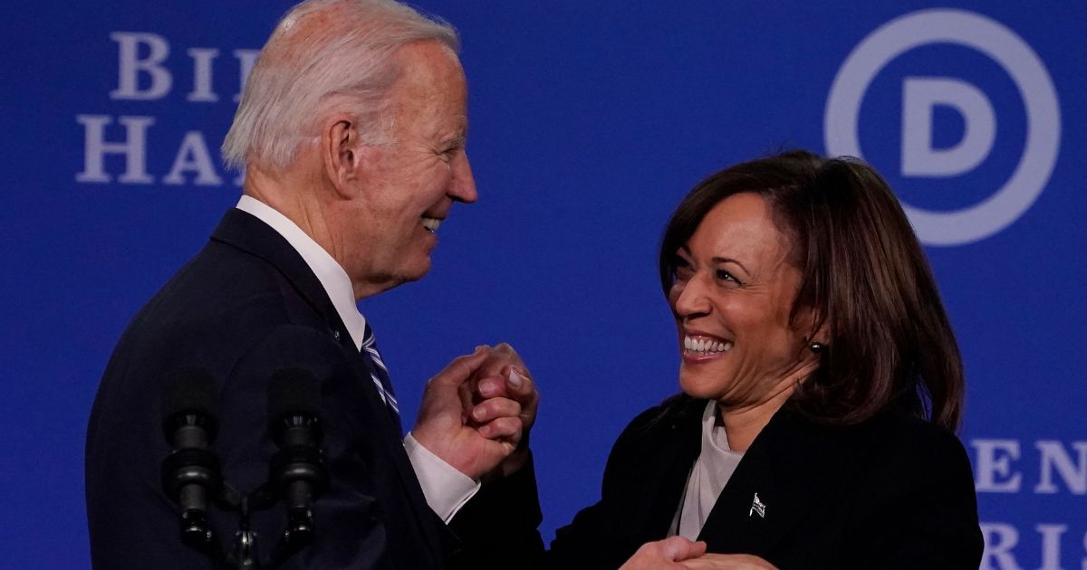 President Joe Biden, left, and Vice President Kamala Harris, right, attend the Democratic National Convention 2023 Winter Meeting in Philadelphia, Pennsylvania, on Friday.