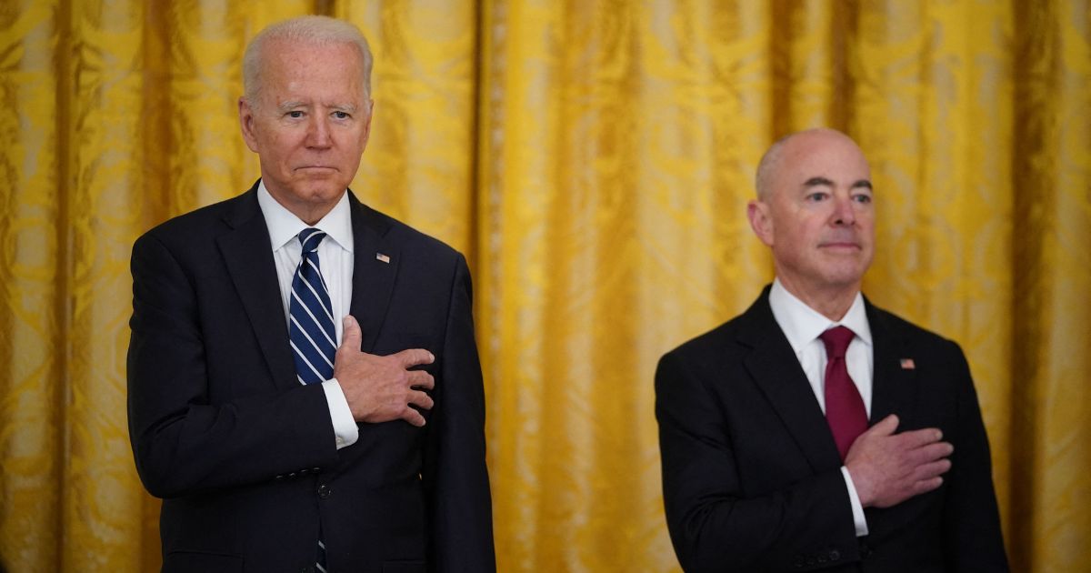 President Joe Biden, left, and Homeland Security Alejandro Mayorkas take part in a naturalization ceremony in the East Room of the White House in Washington on July 2, 2021.