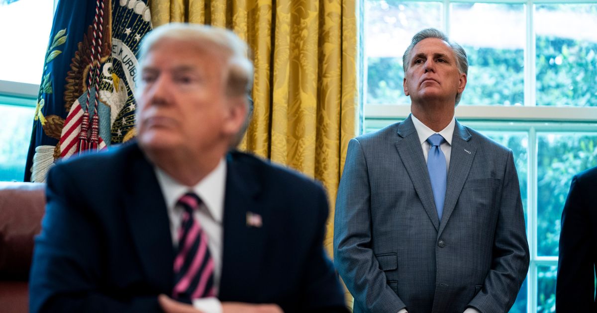 Rep. Kevin McCarthy, right, and then-President Donald Trump attend a ceremony in the Oval Office of the White House on April 24, 2020, in Washington, D.C.