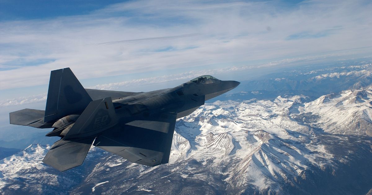 An F/A-22 Raptor flies over the Sierra Nevada Mountains on Nov. 23, 2002, in Northern California.