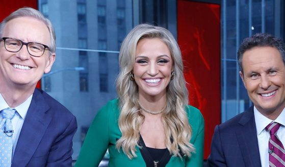 From left, Steve Doocy, Carley Shimkus and Brian Kilmeade host "Fox & Friends" at Fox News Channel Studios in New York City on Sept. 8.