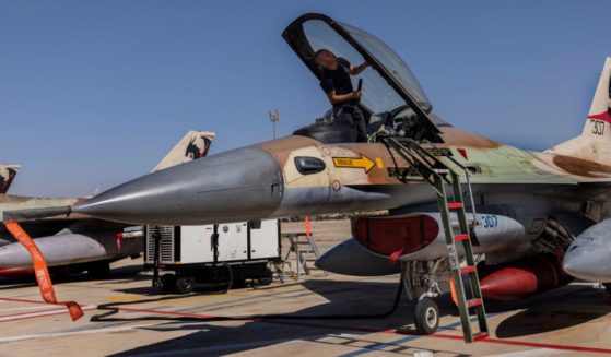 An Israeli F-16I technician checking an air force fighter jet