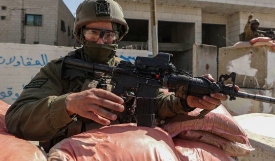 Israeli security forces take position in the town of Huwara in the West Bank on Tuesday.