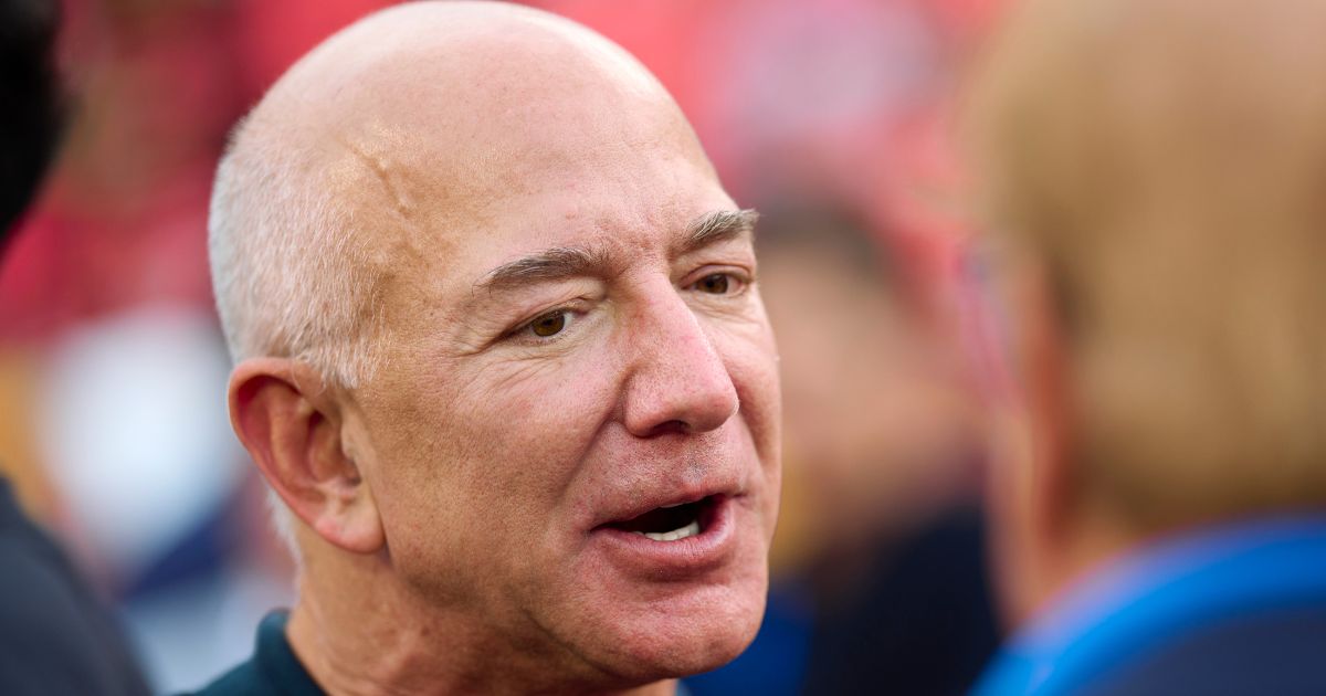 Jeff Bezos looks on from the sidelines before kickoff between the Kansas City Chiefs and Los Angeles Chargers at GEHA Field at Arrowhead Stadium in Kansas City, Missouri, on Sept. 15, 2022.