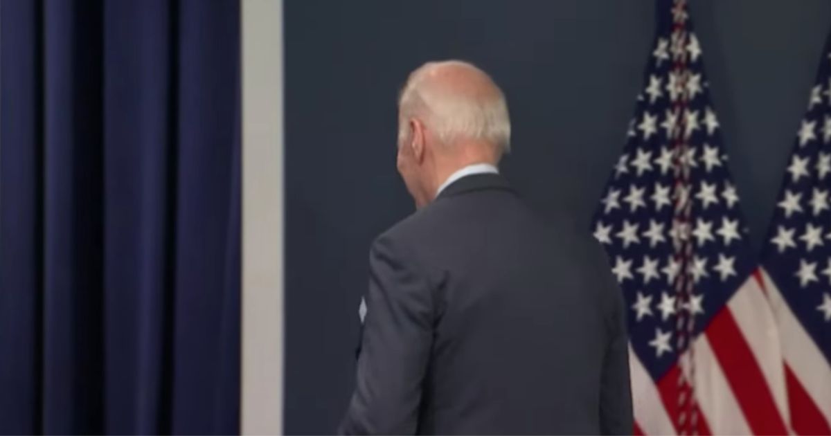 President Joe Biden leaves a news conference on Thursday.