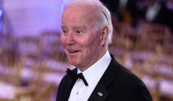 President Joe Biden arrives for the entertainment portion of the evening after a black-tie dinner for governors and their spouses at the White House in Washington, D.C., on Saturday.