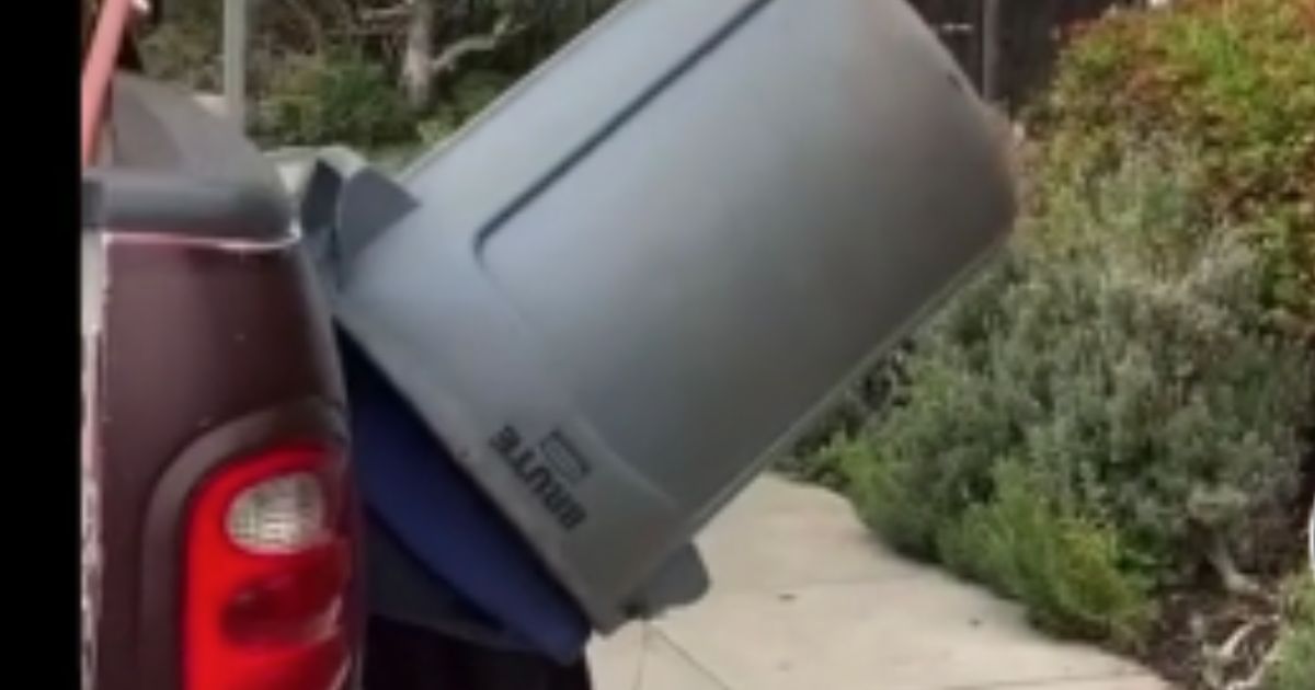 In a video posted to TikTok on Sunday, a masked woman yells at a landscaper, who is recording the interaction, then hides in a trashcan as she continues speaking with the man.