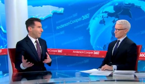 CNN legal analyst Elie Honig, left, talks to host Anderson Cooper.