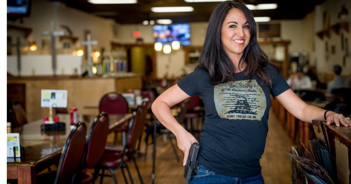 Lauren Boebert poses for a portrait at Shooters Grill in Rifle, Colorado in a file photo from 2018. Now a U.S. Representative, Boebert has cosponsored a new bill to make the AR-15 the national gun of the United States.