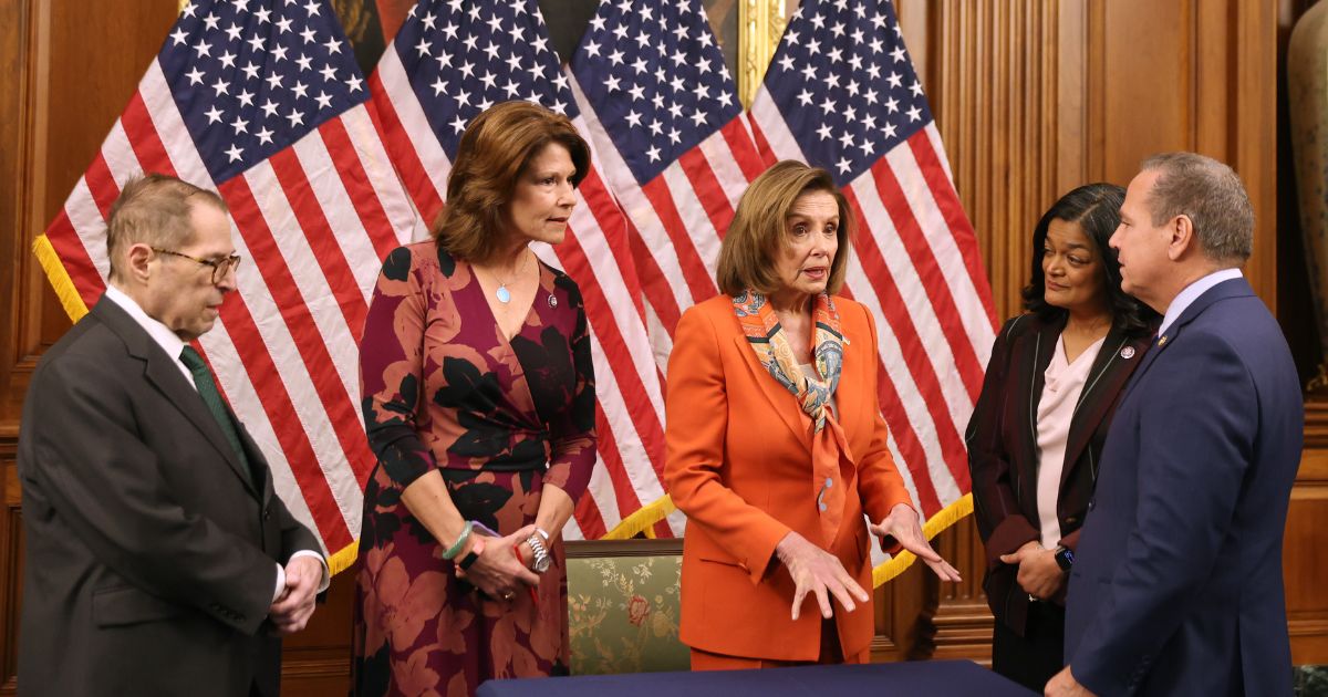 Rep. David Cicilline of Rhode Island, right, speaks with fellow Democrats, from left, Jerry Nadler of New York, Cheri Bustos of Illinois, Nancy Pelosi of California and Pramila Jayapal of Washington at the Capitol in D.C. on March 2, 2022.