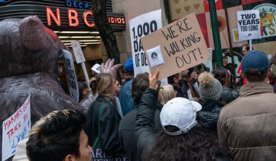 Members of the NBC News Digital union and supporters protest in front of the company's 30 Rock office building in New York City on Thursday.