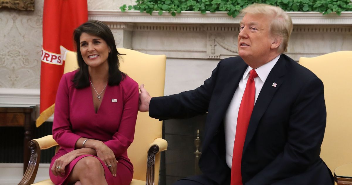 Then-President Donald Trump announces that he has accepted the resignation of Nikki Haley as U.S. ambassador to the United Nations in the Oval Office on Oct. 9, 2018, in Washington, D.C.