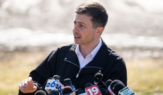 Transportation Secretary Pete Buttigieg talked with the news media as he visited the site of the Norfolk Southern train derailment in East Palestine, Ohio, on Thursday.