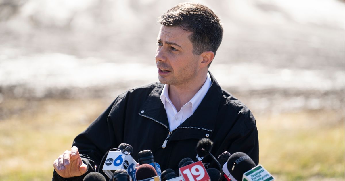 Transportation Secretary Pete Buttigieg talked with the news media as he visited the site of the Norfolk Southern train derailment in East Palestine, Ohio, on Thursday.
