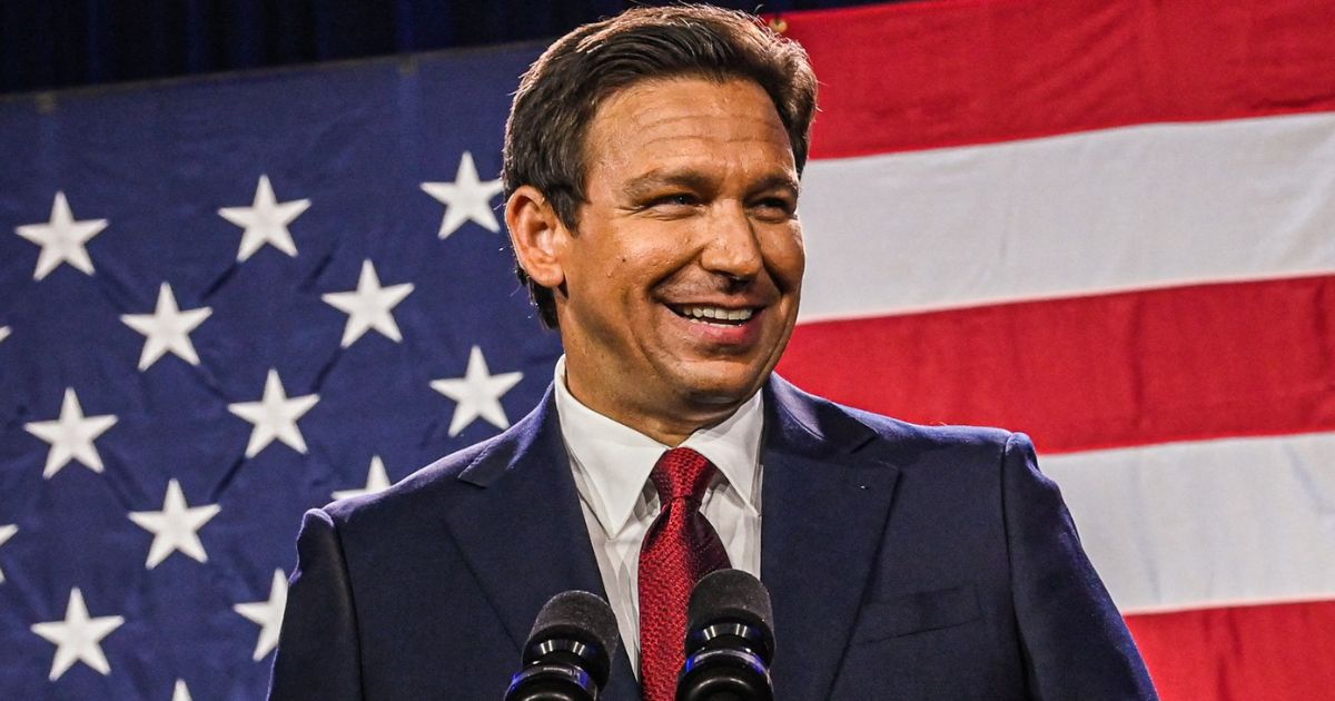Florida Gov. Ron DeSantis smile while speaking to supporters during an election night watch party in Tampa, Florida, on Nov. 8.