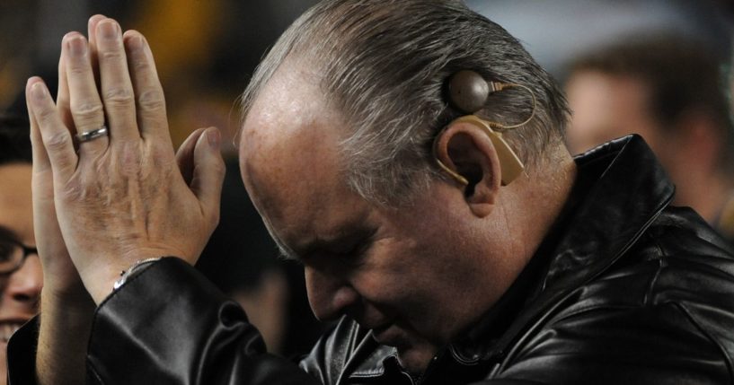Rush Limbaugh thanks the crowd as they cheer him on as he stand on the sideline before an NFL game between the Baltimore Ravens and Pittsburgh Steelers at Heinz Field in Pittsburgh Pennsylvania, on Nov. 6, 2011.