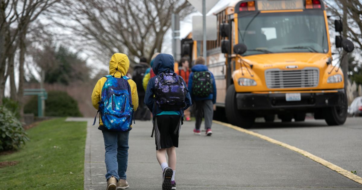 Students leave the Thurgood Marshal Elementary school after the Seattle Public School system in Seattle, Washington, was abruptly closed due to coronavirus fears on March 11, 2020.