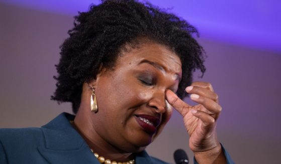 Democratic gubernatorial candidate Stacey Abrams wipes her eye during a concession speech to supporters during an election-night party in Atlanta, Georgia, on Nov. 8, 2022.